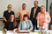 Feierliche Unterzeichnung der umfangreichen Kooperationsvereinbarung in Baunatal. Im Bild sitzend Kathrin Appel-Gllner (links) und Petra Spring. Stehend von links nach rechts Michael Rhein, Stefan Peuser, Christoph Rnnecke und Ulrike Linn.